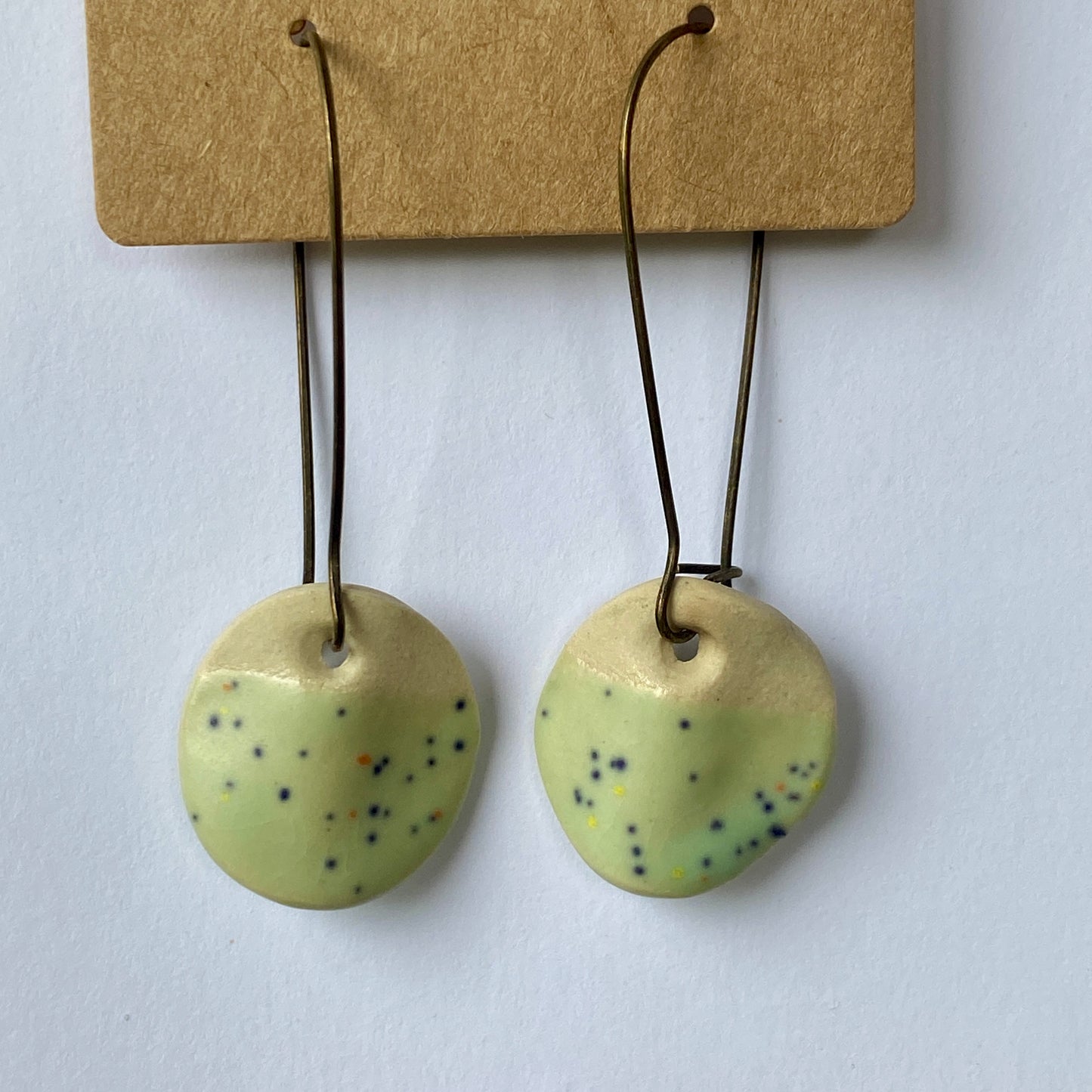 Disc earrings on long kidney hooks - green confetti