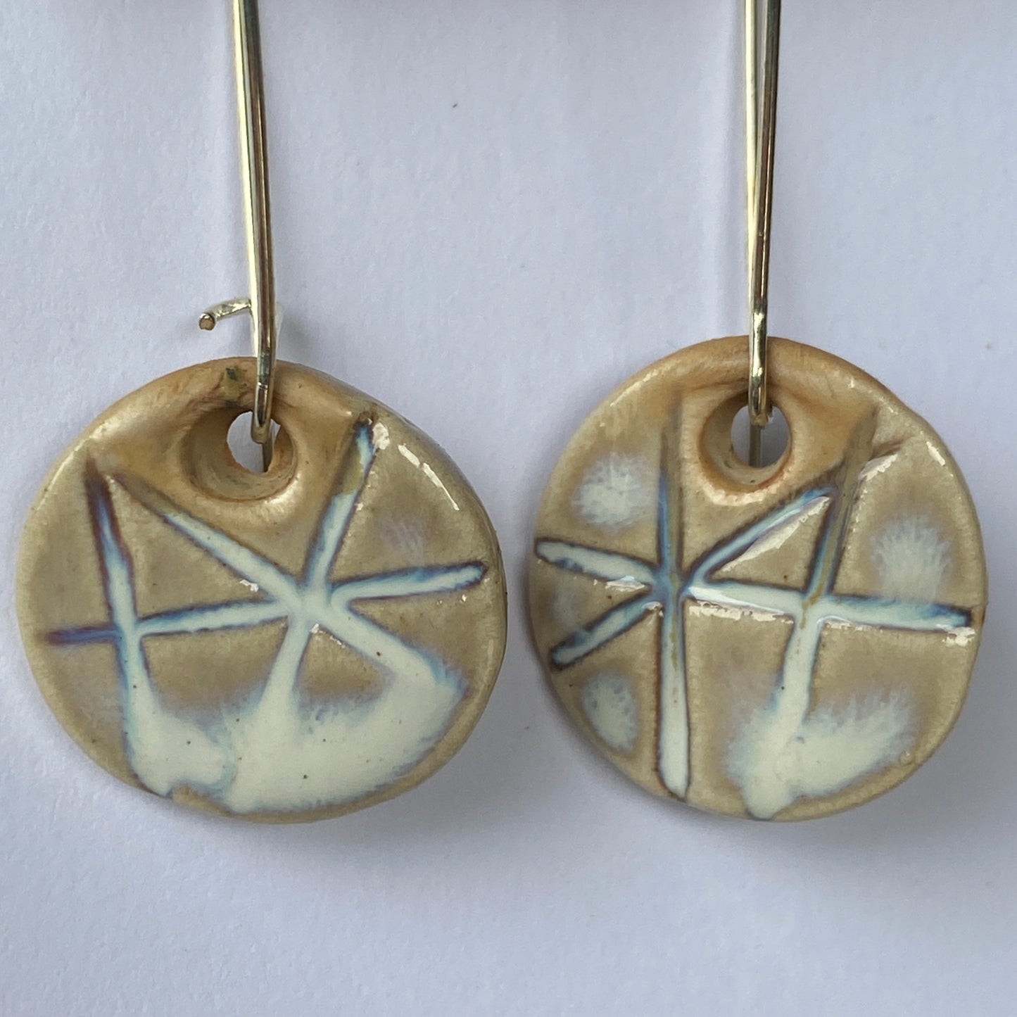Disc earrings on long kidney hooks - milk glass geometric