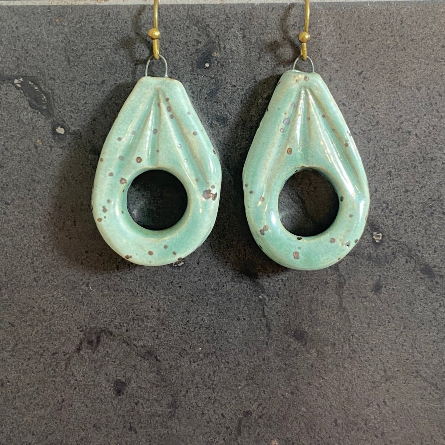 Hollow tear drop shaped earrings - sea green